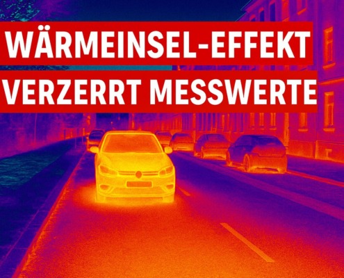 Thermografie-Aufnahme einer Stadtstraße mit Autos und Gebäuden, zeigt den Wärmeinsel-Effekt mit klaren Temperaturunterschieden