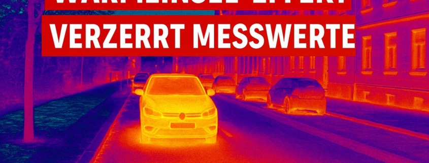 Thermografie-Aufnahme einer Stadtstraße mit Autos und Gebäuden, zeigt den Wärmeinsel-Effekt mit klaren Temperaturunterschieden